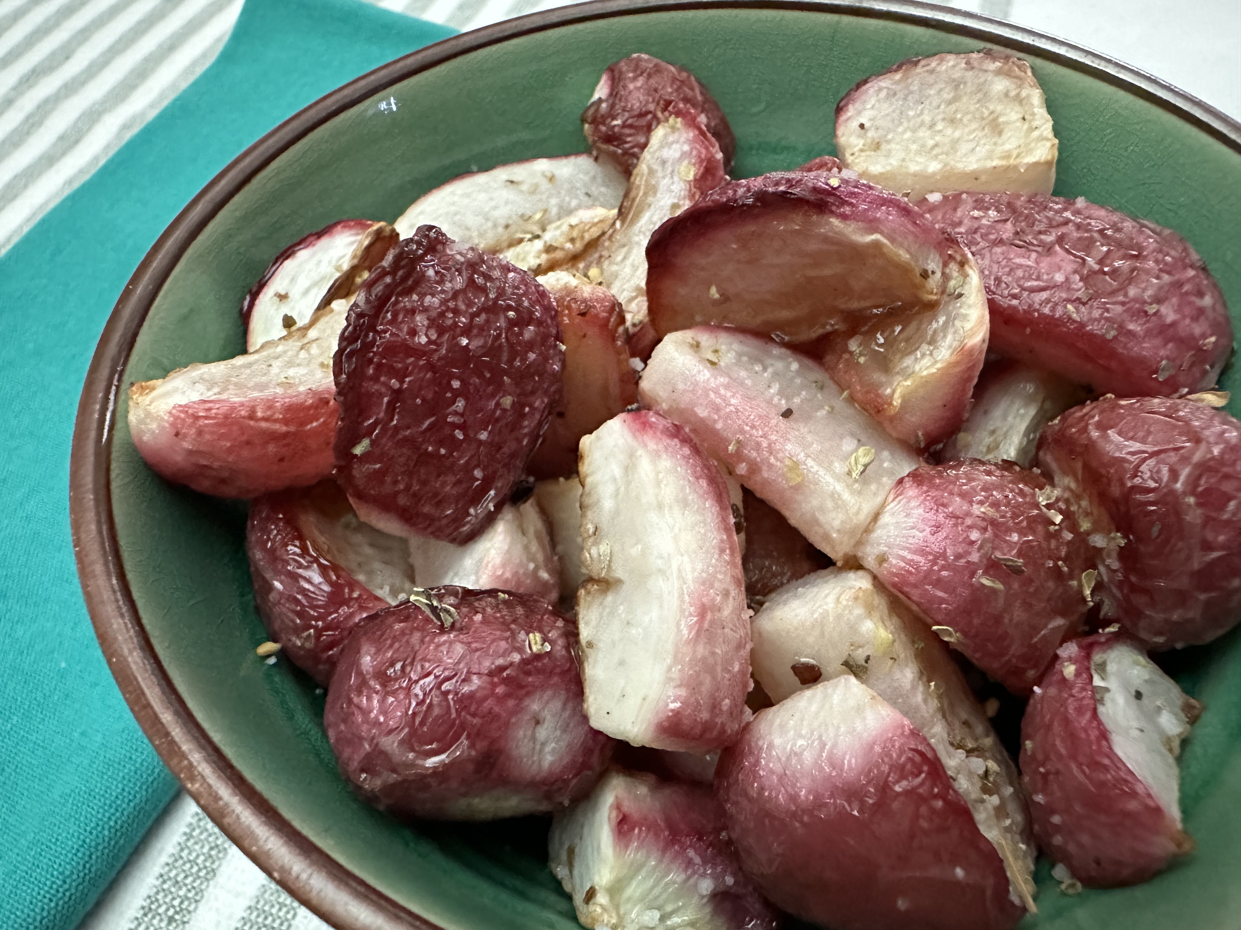 Oven roasted radishes in a bowl.
