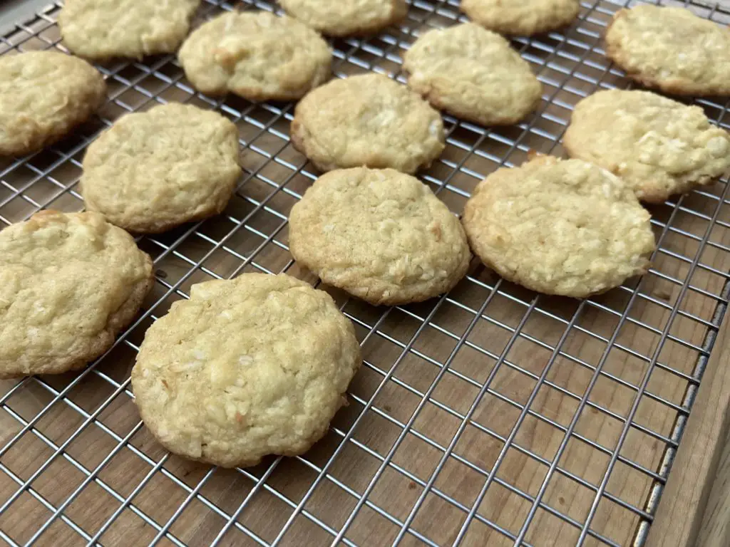 Chewy Coconut Macadamia Nut Cookies on a cooking rack.