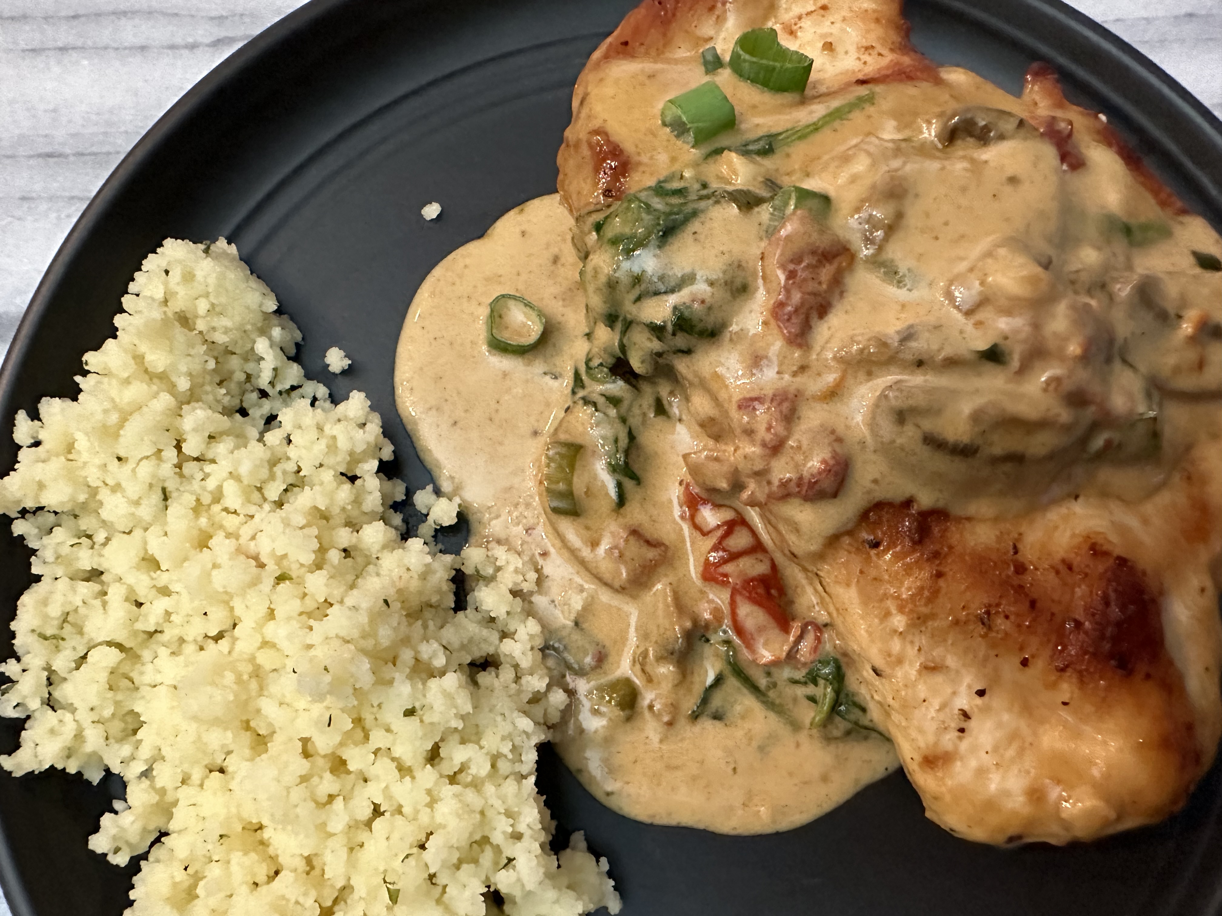 Tuscan chicken in a creamy sauce.